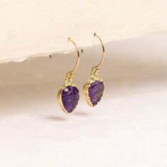 Amethyst Leaf Gold Earrings - 14k Gold Filled earwires - Handmade Minimalist, Petite, Bridal, Bridesmaids, Wife, Girlfriend, Mom, bff Stone: Genuine Amethyst Heart Gemstone: 12mm x 9mm Total length of Earrings: 22mm Earwires: 14K Gold Filled Earwires: 14mm x 14mm Bezel: Vermeil Gold About "Gold Filled Jewelry": Also called rolled-gold. These jewelry items are not actually filled with gold. They are made of a base metal covered by sheets of gold in a mechanical bonding process. Effectively a t... Earwires Handmade, Thick Coat, Amethyst Heart, Heart Gemstone, Gold Filled Jewelry, Base Metal, Gemstone Earrings, Jewelry Care, Handmade Natural