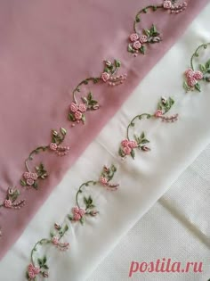 pink and white satin with embroidered flowers on the side, along with two different color fabrics