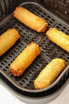 several fried food items are being cooked in an air fryer