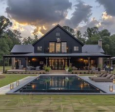 a large house with a pool in front of it