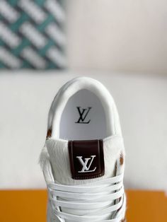 Channel your inner cowboy with these statement-making sneakers inspired by Louis Vuitton's bold and distinctive design. The eye-catching cowhide print, rendered in rich brown tones, sets these shoes apart from the ordinary. Crafted with meticulous attention to detail, they feature the iconic "LV" initials and "#54" signature, paying homage to Louis Vuitton's heritage. Experience the perfect blend of luxury, individuality, and Western flair. Disclaimer: This product is inspired by the Louis Vuitt Brown Luxury High-top Sneakers, Luxury Brown Sneakers For Streetwear, Designer Brown Calf Leather Sneakers, Luxury Brown Custom Sneakers For Streetwear, Designer Custom Brown Calf Leather Sneakers, Designer Brown Calf Leather Custom Sneakers, Designer Brown Custom Sneakers With Round Toe, Pony Sneakers, Cowhide Print