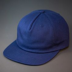 An Unstructured, 100% Premium Cotton, Blank Pinch Front Hat With a Premium Leather Back Strap & Brass Clasp. One of our teams favorite pieces, this unassuming, unstructured pinch front 5 panel is one for the ages. Constructed from a sturdy, medium weight, 100% Cotton base and finished with a premium leather strap & Brass Clasp. We designed the ROAM Strapback for the adventurer in all of us. Custom Roam Strapback Hat in Navy | Cotton | Apparel | Headwear | Baseball Caps Cotton Flat Bill Baseball Cap, Navy Cotton 5-panel Baseball Cap, Navy Snapback Hat With Flat Brim For Sports Events, Navy Flat Brim Snapback Hat For Sports Events, Solid Snapback Dad Hat For Streetwear, Solid Color Snapback Dad Hat For Streetwear, Solid Color Dad Hat For Streetwear, Classic Baseball Cap With Curved Brim For Sports Events, Classic Curved Brim Baseball Cap For Sports Events