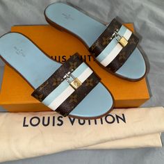 Louis Vuitton Lock It Monogram Mules In A Size 40. Bi-Color Blue And Brown. Date Code Is Ma 0148. Comes With Box And Dust Bag. In Good Condition. Authentic. Shoes Louis Vuitton, Lock It, Slides Sandals, Blue And Brown, Louis Vuitton Shoes, Blue Sandals, Blue Brown, Women's Shoes Sandals, Slides