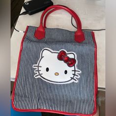 Selling A Brand New Hello Kitty Tote Bag. Colors Are Red, Black And White. Measures Around 12” Long And Approximately 11” Wide And Around 4”” Width. Cute Red Bag With Large Capacity, Cute Red Bags With Large Capacity, Cute Large Capacity Red Bag, Rectangular Hello Kitty Shoulder Bag For Everyday Use, Cute Red Bags For Everyday Use, Hello Kitty Everyday Rectangular Shoulder Bag, Cute Red Satchel Bag, Cute Red Shoulder Bag, Hello Kitty Rectangular Bag For Daily Use