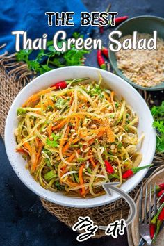 a white bowl filled with noodles and vegetables