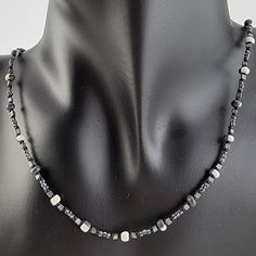 Handmade unisex beaded necklace with seed beads in black and white, grey, and black Cheap Festival Necklaces With Black Beads, Cheap White Necklace With Black Beads, Adjustable Gray Necklace With Silver Beads, Silver Beaded Necklace With Black Hematite Beads, Silver Hematite Beaded Necklace With Black Beads, Black Hematite Beaded Necklaces With Round Beads, Black Hematite Beaded Necklaces, Necklace With Beads, Handmade Beaded Necklace