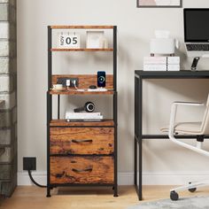 a desk with a computer and some drawers