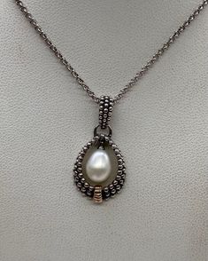 "Beautiful Vintage 925 Sterling Silver & 14k Gold with Genuine Pearl Teardrop Necklace good pre/owned condition measures 18\" length and the pendant measures 1 1/8\"" Stamped 925 Teardrop Pendant Necklace For Anniversary, Elegant 925 Stamped Teardrop Pendant Jewelry, Elegant 925 Stamped Teardrop Pendant, Elegant Handmade Pear-shaped Necklaces, Classic Teardrop Hallmarked Necklaces, Classic Hallmarked Teardrop Necklaces, Hallmarked White Gold Teardrop Necklace, White Gold Teardrop Necklace Hallmarked, Elegant Teardrop Necklace With Sterling Silver Clasp