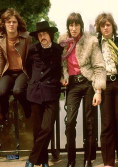 the rolling stones are posing for a photo