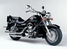 a black motorcycle parked in front of a white background