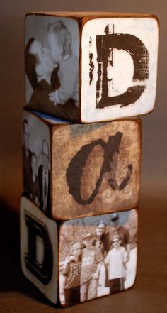 three blocks with different pictures on them and the letters d are stacked up in front of each other