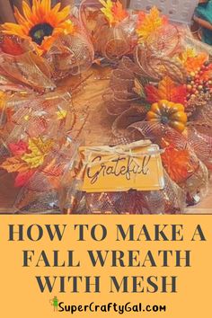 a table topped with fall wreaths and sunflowers