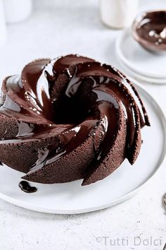 a chocolate bundt cake on a white plate