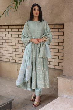 Sea foam green vegan silk chikankari inspired anarkali with woven vertical stripes in star pattern and paisley motifs with a thick horizontal border. Paired with pants with a thick border and a mandala pattern dupatta with four sided border.
Component: 3
Pattern: Woven
Type Of Work: Star,paisley,mandala motifs
Neckline: Round
Sleeve Type: Three quarter
Fabric: Vegan Silk
Color: Green
Other Details: 
Star,paisley,mandala patterns
Note: The hand accessory worn by the model is not for sale
Occasion Friends Engagement Outfit Indian, Lengha Inspiration, Kurti Poses, Neha Rajpoot, Chikankari Dress, Function Dress, Ethenic Wear, Indian Closet, Desi Fits