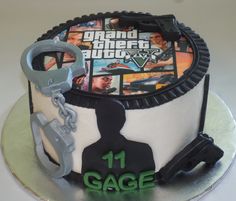 a birthday cake with video game characters on it and handcuffs hanging from the top tier