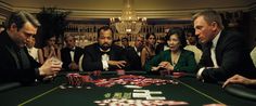 people playing cards at a casino table