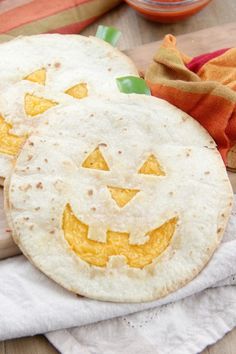 two tortillas with jack - o'- lantern faces on them