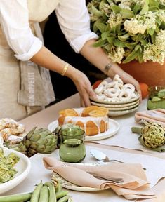 a table topped with lots of different types of food