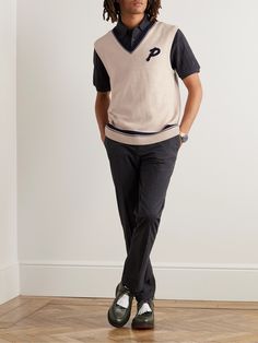 DESIGNED BY MR PORTER. An easy way to reinvent your wardrobe is to think outside the box when it comes to layering – adding a sweater vest will make a nice contrast to a jersey tee or poplin shirt. Mr P.'s style is knitted from merino wool and patterned with stripes at the edges. The textured 'P' is a nod to sporting teams' crests. Lower Impact Materials. This product is made using at least 50% lower-impact materials or ingredients. Find out more about our Consciously Crafted criteria here. Casual Three-stripes Golf Tops, Golf Brand Sweater, Cotton Branding Golf T-shirt, Sporty Green Golf T-shirt, Golf Logo, Sweater Vest Mens, Functional Moisture-wicking Golf Polo Shirt, Merino Wool Sweater, Mens Vest