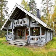 a small log cabin in the woods