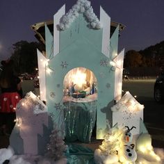 an outdoor christmas display with snowmen and lights