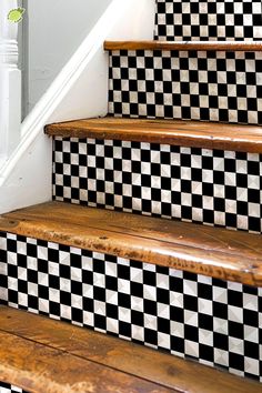 some stairs with black and white tiles on them