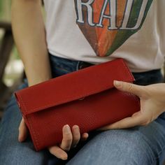 With so many ladies' wallets on the market, it's difficult to decide which one best fits your needs. We are here to help and believe we have some great options to consider. Our Handmade Ladies Red Wallet is a comfortable way to carry your necessities. There are two bill compartments, 12 storage slots for cards and two open space compartments. The interior zipper pocket is perfect for those small items and loose change. Everything closes easily with a magnetic closure. Beyond its great appearance Versatile Red Wallet For Everyday Use, Handmade Red Wallet For Everyday Use, Versatile Red Wallets For Everyday Use, Elegant Red Everyday Wallet, Women Sling Bags, Leather Corporate Gifts, Sling Bags Women, Sling Bag Men, Luxury Red Wallet For Daily Use