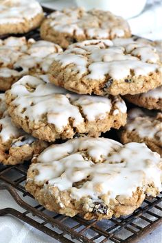 iced oatmeal raisin cookies with white icing on a cooling rack