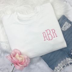 two personalized t - shirts, one with the initials on it