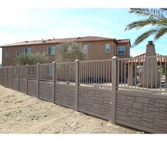 a brown fence is in front of a house