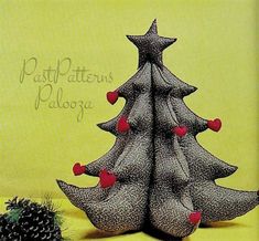 a drawing of a christmas tree with red hearts on it and pine cones in the foreground