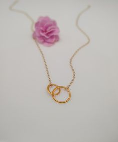 "All items ordered 5/14/21 - 5/30/21 will be shipped out on 5/31/21 Our gift to you 10% off your first purchase. Details here - http:/eepurl.com/dpVPBz Interlocking circle necklace. Simple modern and special. Makes a thoughtful gift for mother/daughter, besties, sisters and bridesmaids. DETAILS Necklace features two dainty interlocking circles Your choice of sterling silver or 24 k gold plate or bronze/sterling silver circles Sterling silver or 14 k gold fill dainty chain In picture 2, silver is Linked Rings, Double Circle Necklace, Sister Bridesmaid, Mom Best Friend, Dainty Necklace Layered, Interlocking Circle Necklace, Wishbone Necklace, Crown Necklace, Gold Necklace Simple