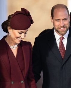 the royal couple are smiling and holding hands