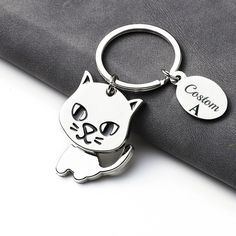 a close up of a key chain with a cat on it