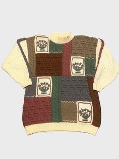 Get cozy with this vintage patchwork chunky knit jumper from the 1990s. Made from 100% Wool, this inspired piece features a multi colour patchwork and floral design that add a vintage pop to any outfit. It is labeled a size S but measurements run L/XL at 44 inch measurement all around. This original hand knitted jumper is a must have for any vintage enthusiast  Excellent like new condition Retro Patchwork Knit Sweater, Vintage Patchwork Crew Neck Sweater, Vintage Crew Neck Patchwork Sweater, Vintage Hand Knitted Multicolor Sweater, Vintage Multicolor Hand Knitted Sweater, Vintage Multicolor Hand-knitted Sweater, Patch Sweater, Jumper Designs, Hand Knitted Jumpers