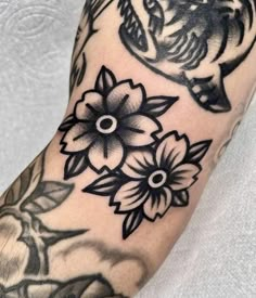 an arm with some flowers on it