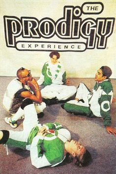 a group of men sitting on the ground in front of a sign that says prodigy experience