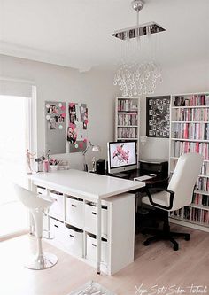 a home office with bookshelves, desk and chairs