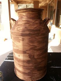 a large brown vase sitting on top of a table