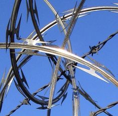 barbed wire with blue sky in the background