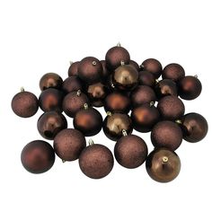 a pile of brown christmas balls sitting on top of each other