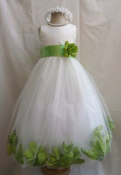 a white dress with green flowers on it