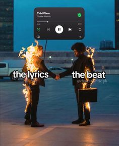 two people standing next to each other with fire in their hands and the caption reads, the lyrics the beat