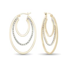 Take your look to the next level with these eye-catching Diamond Fascination™ hoop earrings. Created in sterling silver with 18K gold plate, each layered 40.0 x 25.0mm hoop showcases a trio of oval-shaped ribbons. The center glistens with a single diamond accent and Diamond Fascination™ beading, a patented handmade process which crystallizes diamond dust into enamel to simulate round-cut diamonds. Buffed to a brilliant luster, these earrings secure with latch backs. Diamond Dust, Buying Diamonds, Gold Plated Earrings, Diamond Stone, Earring Backs, Round Cut Diamond, Sterling Earrings, Designer Earrings, Fashion Earrings