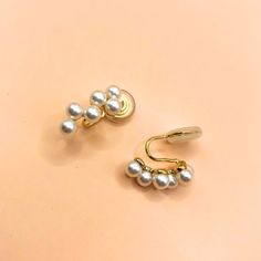 14K gold plated pearl clip on earrings come with pouch.  Main material: copper, pearls 14K gold plated  Pattern: geometric size: 1.8x0.9 cm Gold Pearl Charm Clip-on Earrings, Gold Clip-on Earrings With Pearl Charm, Gold Clip-on Pearl Earrings With Pearl Charm, Elegant Gold Clip-on Ear Cuff, Gold Clip-on Ear Cuff For Formal Occasions, Gold Clip-on Pearl Earrings, Gold Pearl Ear Cuff Gift, Gold Pearl Ear Cuff As A Gift, Elegant Gold Ear Cuff With Pearl Drop