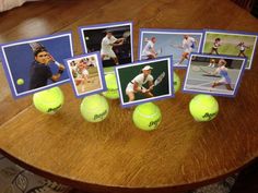 there are tennis balls and pictures on the table with them in front of each other