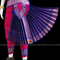 Design by Classical Dance Jewelry® ❥ Traditional Bharatanatyam costume wore during regular dance programs or arrangetram performance. ❥ Material : Art Silk ❥ Type : Traditional pant costume ❥ Easy to wear ❥ layer front fan ❥❥❥❥ 32 inch PANT LENGTH Dress Measurements ( all the measurements approximately 1 -2 margin buffer) Age: 9 - 12 yrs ❥ PANT MEASUREMENTS: ☛ Pant Length: 31-32 inch ☛ Pant Waist: 29-30 inch ☛ Pant Hip: 30-31 ❥ BLOUSE MEASUREMENTS: ☛ Blouse length: 11-12 inch ☛ Blouse Shoulder : Multicolor Sets For Dance Festivals, Multicolor Dance Sets For Festivals, Multicolor Festival Dance Sets, Blue Churidar With Pallu For Traditional Ceremonies, Blue Traditional Wear With Peacock Design For Festivals, Traditional Multicolor Dance Sets, Traditional Fitted Dance Sets, Traditional Drape Sets For Dance And Diwali, Traditional Drape Sets For Diwali Dance