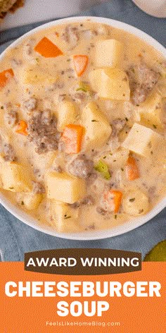 a bowl of cheeseburger soup with carrots and bread