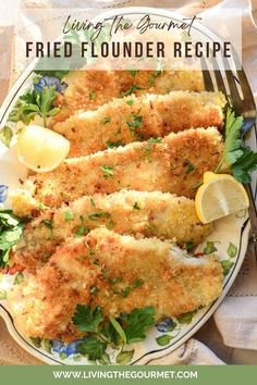 fried fish on a plate with lemon wedges and parsley garnishes