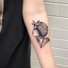 a woman's arm with a tattoo design on the left side of her body